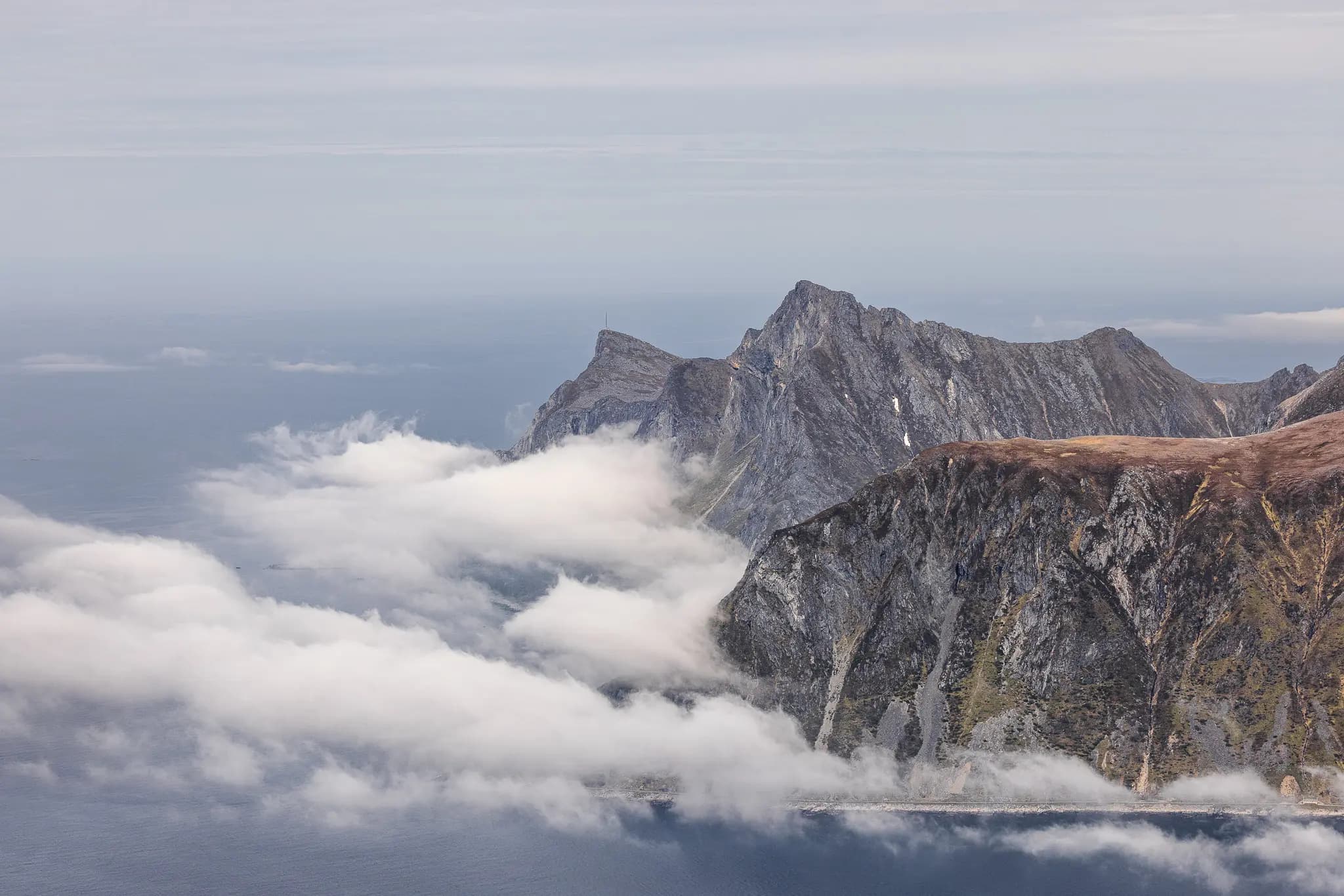 Cloud plays around the rugged coastline of the Lofoten Islands