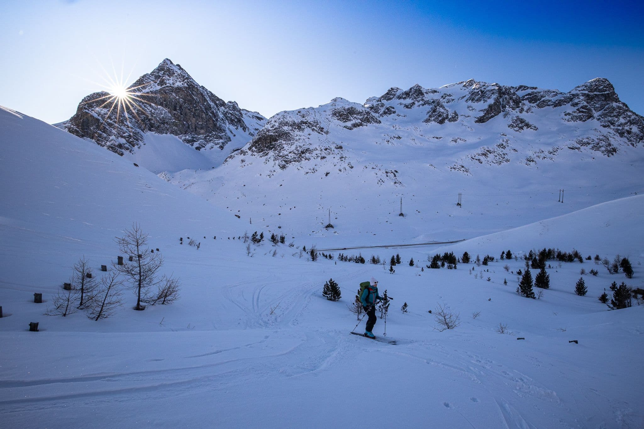 Wärmende Sonnenstrahlen über dem Piz Polaschin