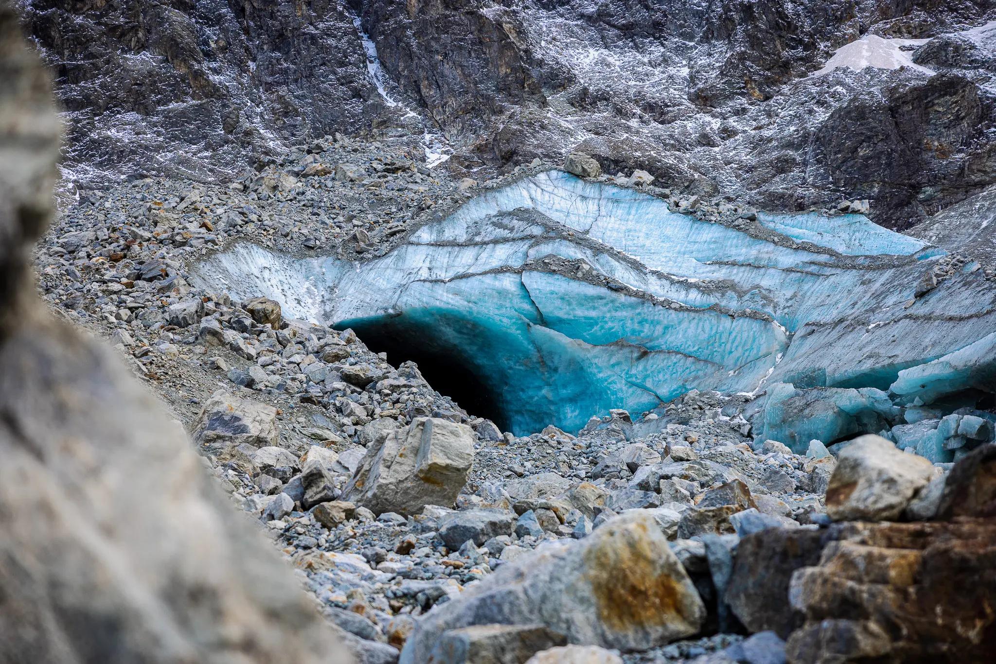 The entrance to the ice cave, the tons of stones lying around on the edge suddenly threaten to slide off