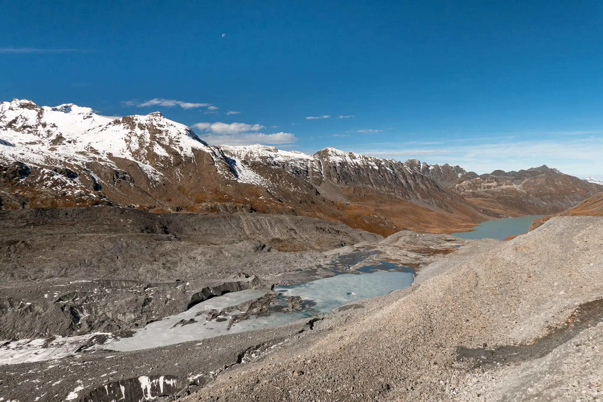 Glacial lake at the end of Glacier de Cheilon, formed by the melting of the glacier